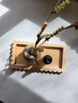  Handmade scalloped wood catch-all tray on a white surface, featuring a natural hardwood finish. Styled with a small wooden vase and a perfume bottle, perfect for use as a jewelry dish, valet tray, or dresser organizer