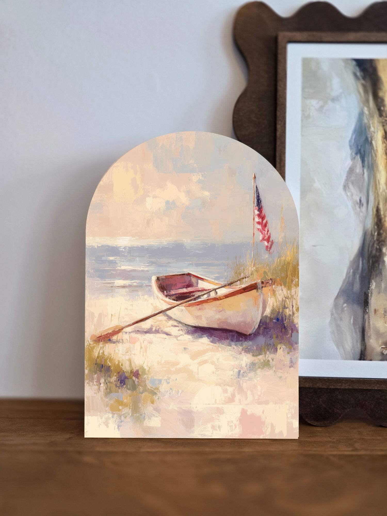 Painterly coastal arch sign with rowboat, American flag, and sandy beach scene; printed on 0.25" wood.