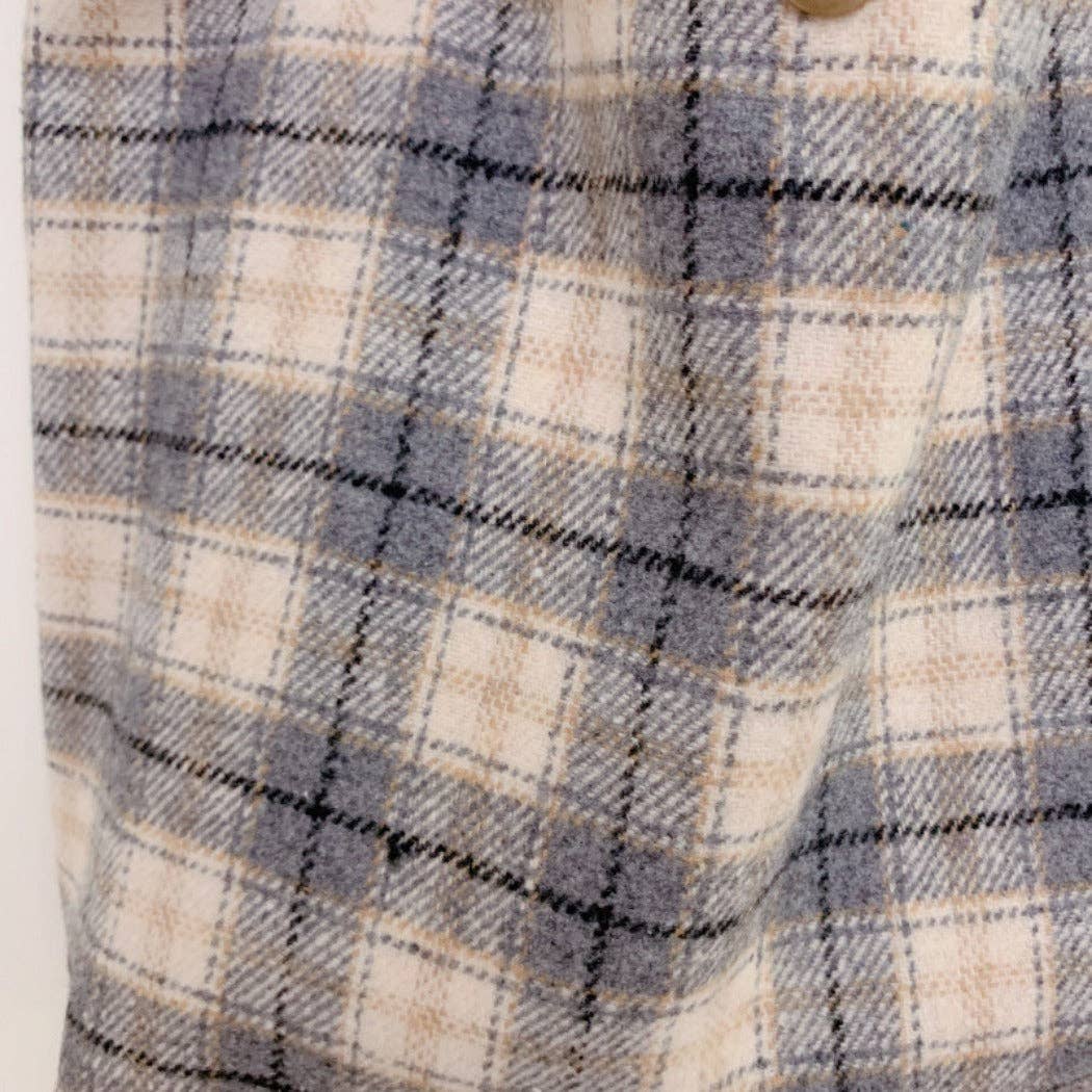 Close-up of plaid fabric on checkered handbag.